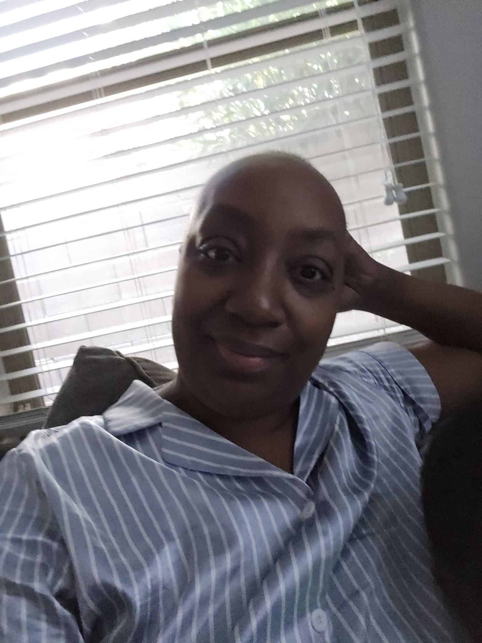 Image of Clarissa relaxing as she takes in sunlight before her upcoming surgery.